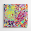 Yellow-green abstract artwork with colorful clustered marks, digitally staged on a white wall