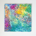 Confetti Garden abstract artwork on raw unstretched canvas against a softly lit off-white wall