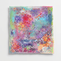 Pastel abstract artwork with aqua, lilac, coral, and orange marks on a white wall.